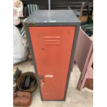 A METAL SINGLE DOOR CABINET WITH KEY