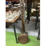 A VINTAGE COPPER WARMING PAN AND FURTHER PAN