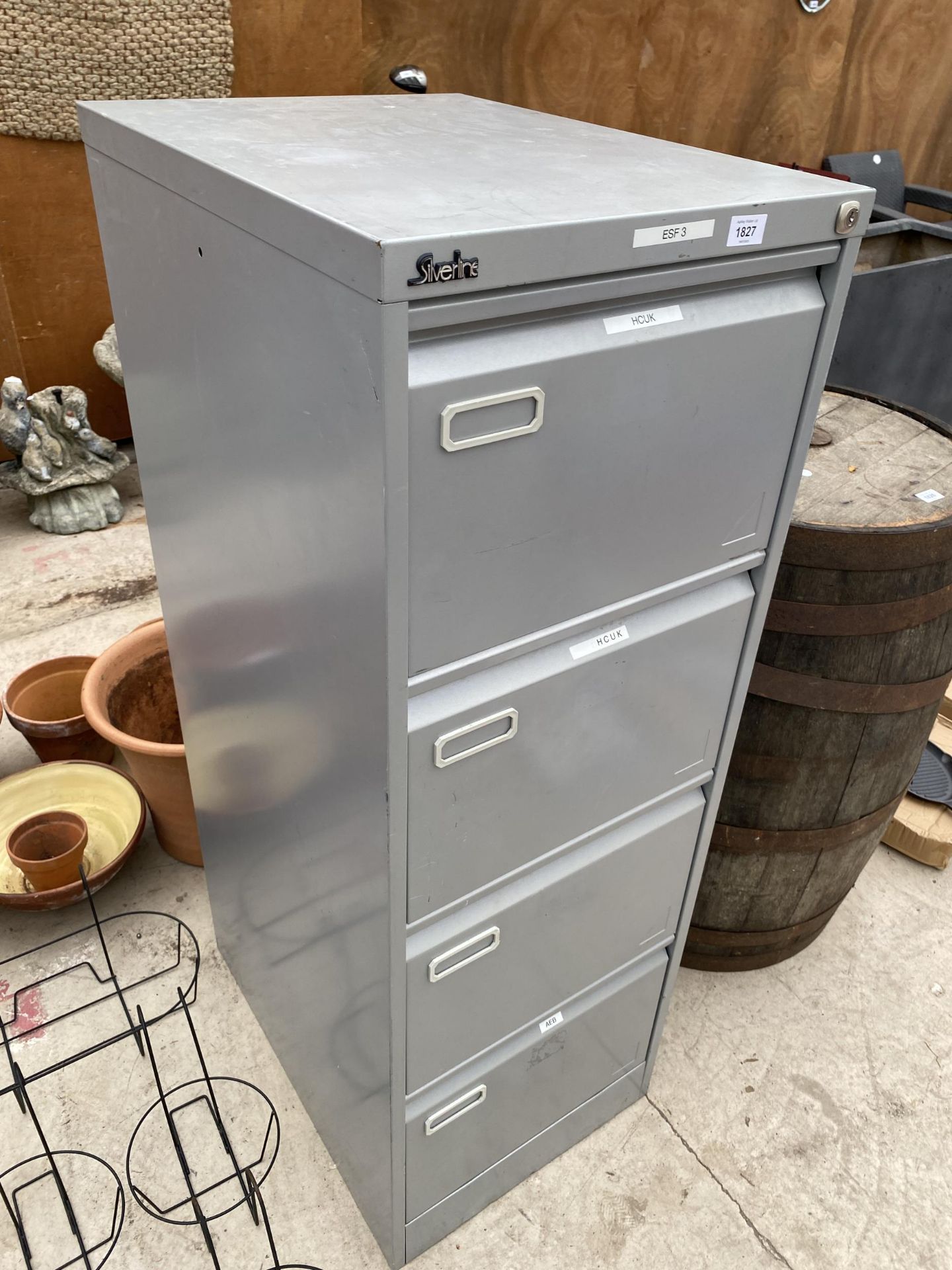 A SILVERLINE FOUR DRAWER METAL FILING CABINET