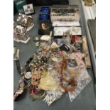 A LARGE QUANTITY OF COSTUME JEWELLERY TO INCLUDE NECKLACES, EARRINGS, BANGLES, RINGS, ETC - SOME
