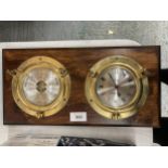 A MAHOGANY FRAMED BRASS PORTHOLE STYLE CLOCK AND BAROMETER