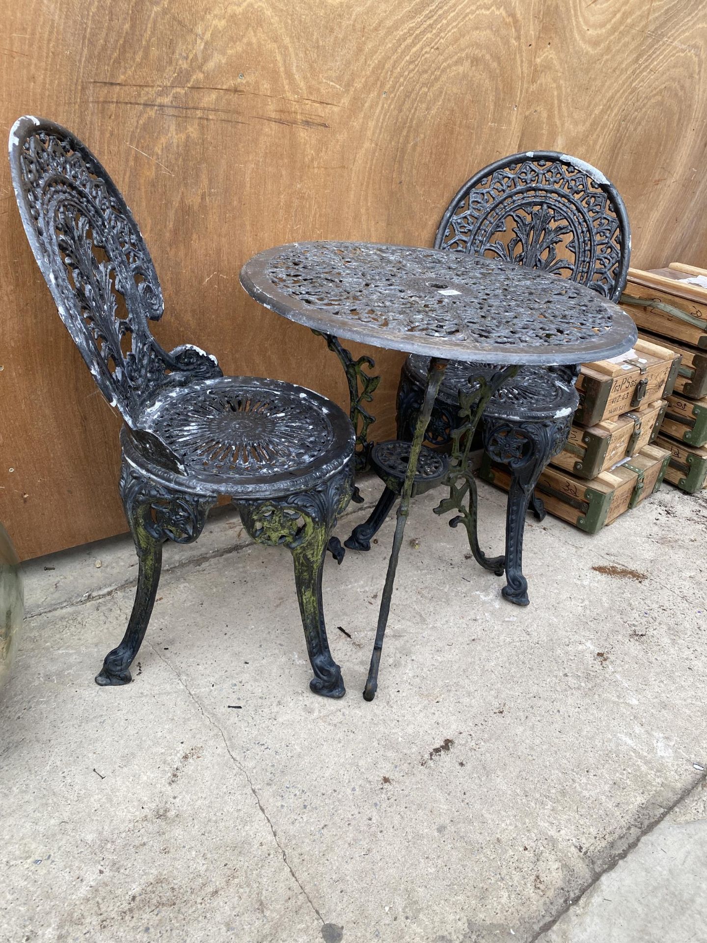 A VINTAGE CAST ALLOY BISTRO SET COMPRISING OF A ROUND TABLE AND TWO CHAIRS - Image 2 of 2