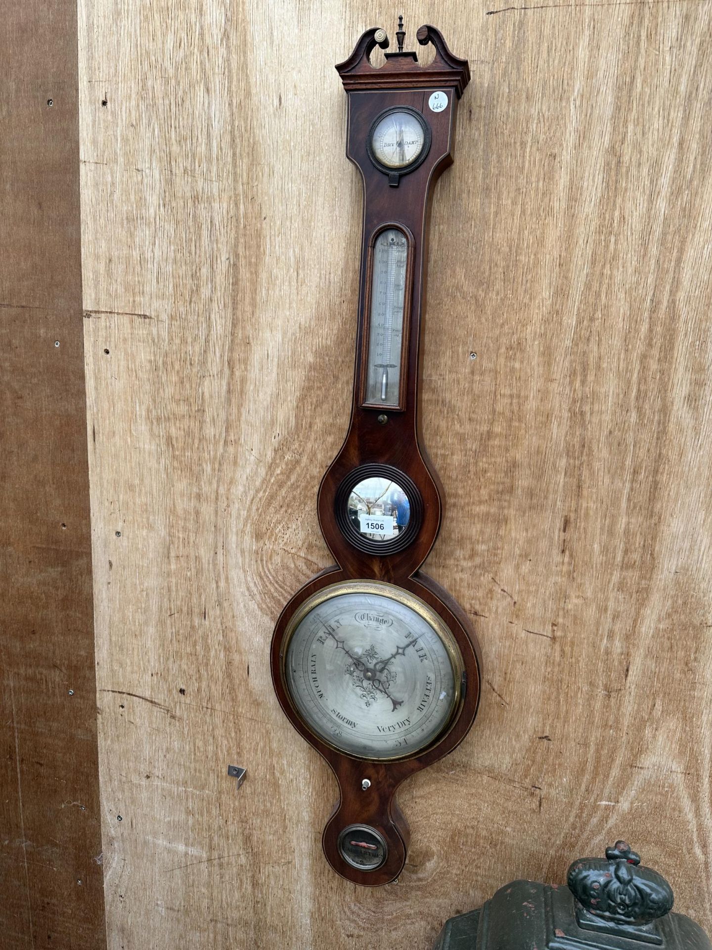 A VINTAGE OAK CASED BAROMETER BEARING THE NAME 'F STINGA' CARMARTHEN