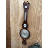 A VINTAGE OAK CASED BAROMETER BEARING THE NAME 'F STINGA' CARMARTHEN