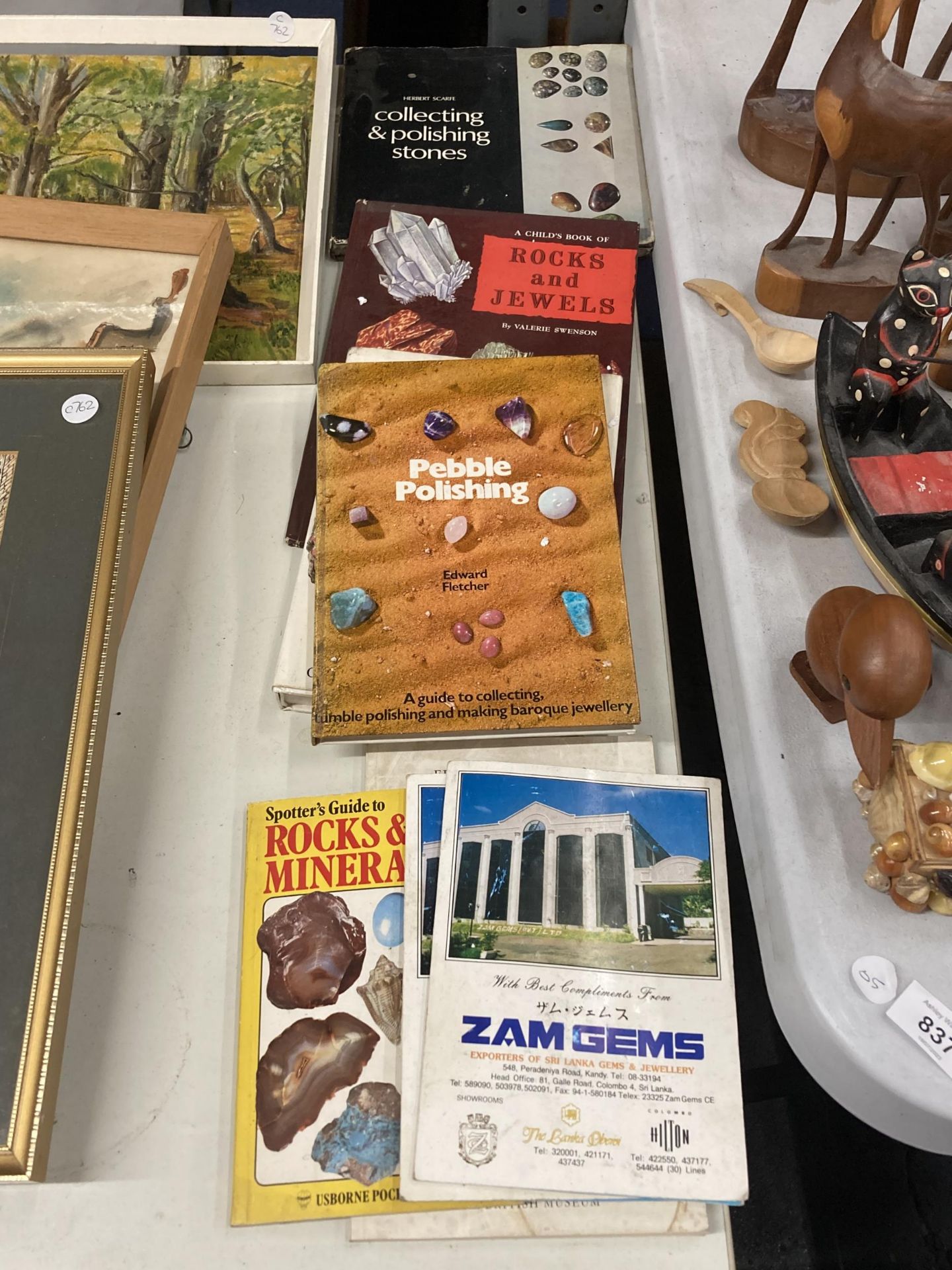 SIX BOOKS ON ROCKS AND JEWELS INCLUDING TWO CARDS OF UNCUT GEMS FROM SRI LANKA