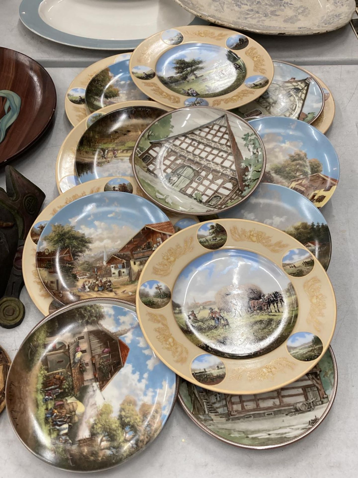 A LARGE QUANTITY OF CABINET/WALL PLATES TO INCLUDE RURAL SCENES