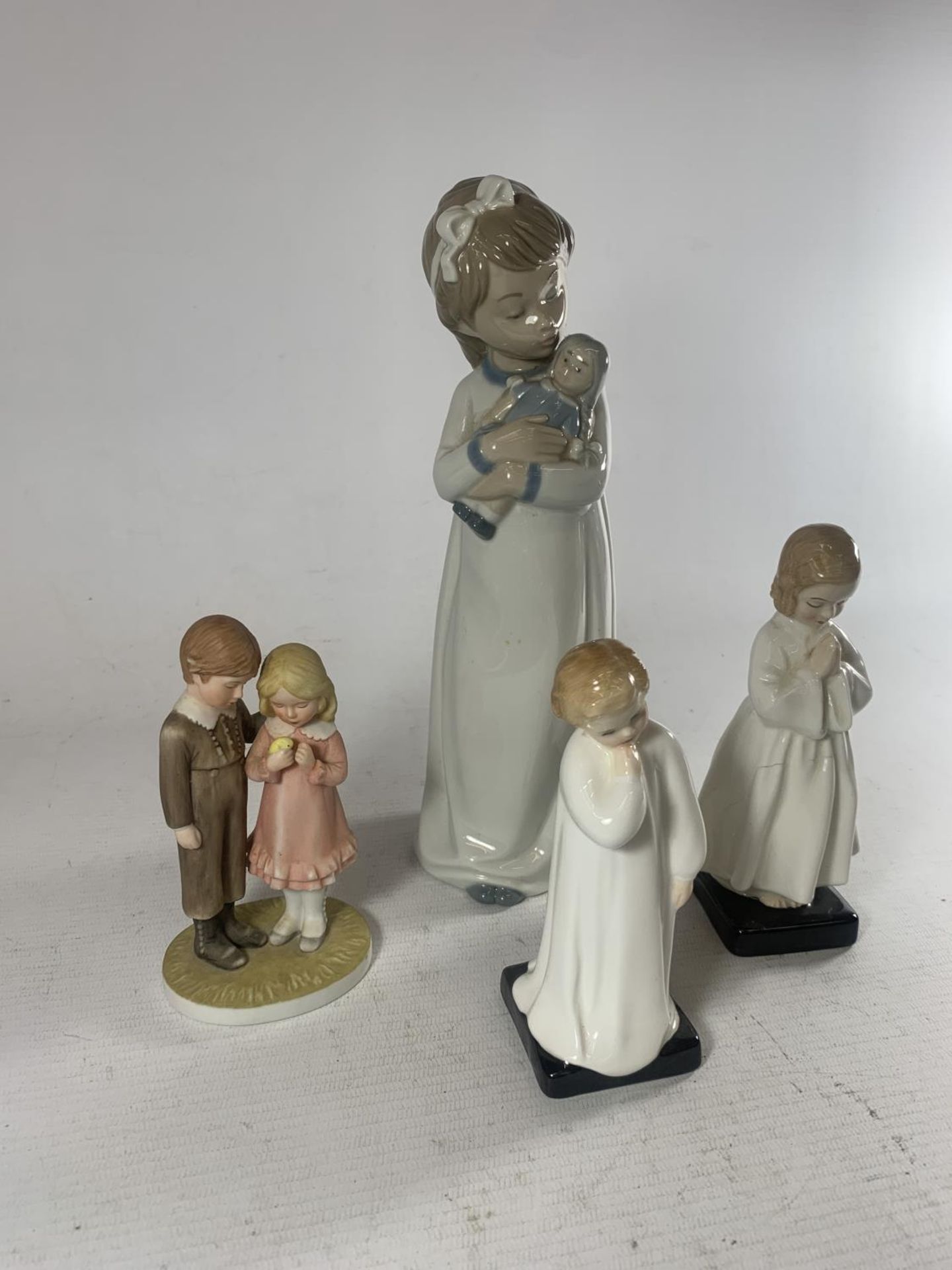 FOUR VARIOUS FIGURES TWO ROYAL DOULTON, A NAO AND A ROYAL OSBOURNE (ONE A/F SEE PHOTOS)