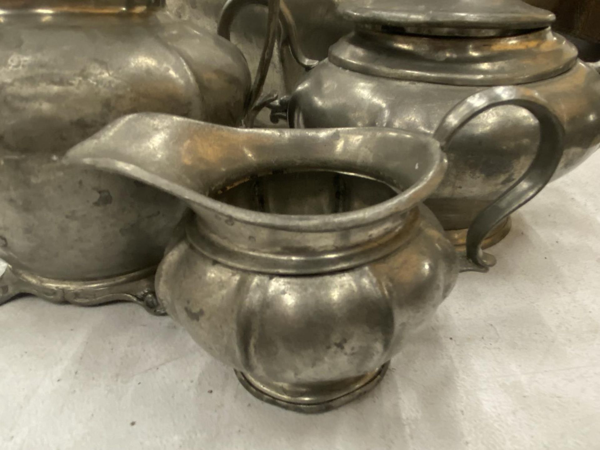 A PEWTER TEASET TO INCLUDE TEAPOT, SUGAR, MILK AND HOT WATER JUG - Image 3 of 6