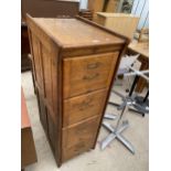 AN EARLY 20TH CENTURY OAK 4 DRAWER FILING CABINET