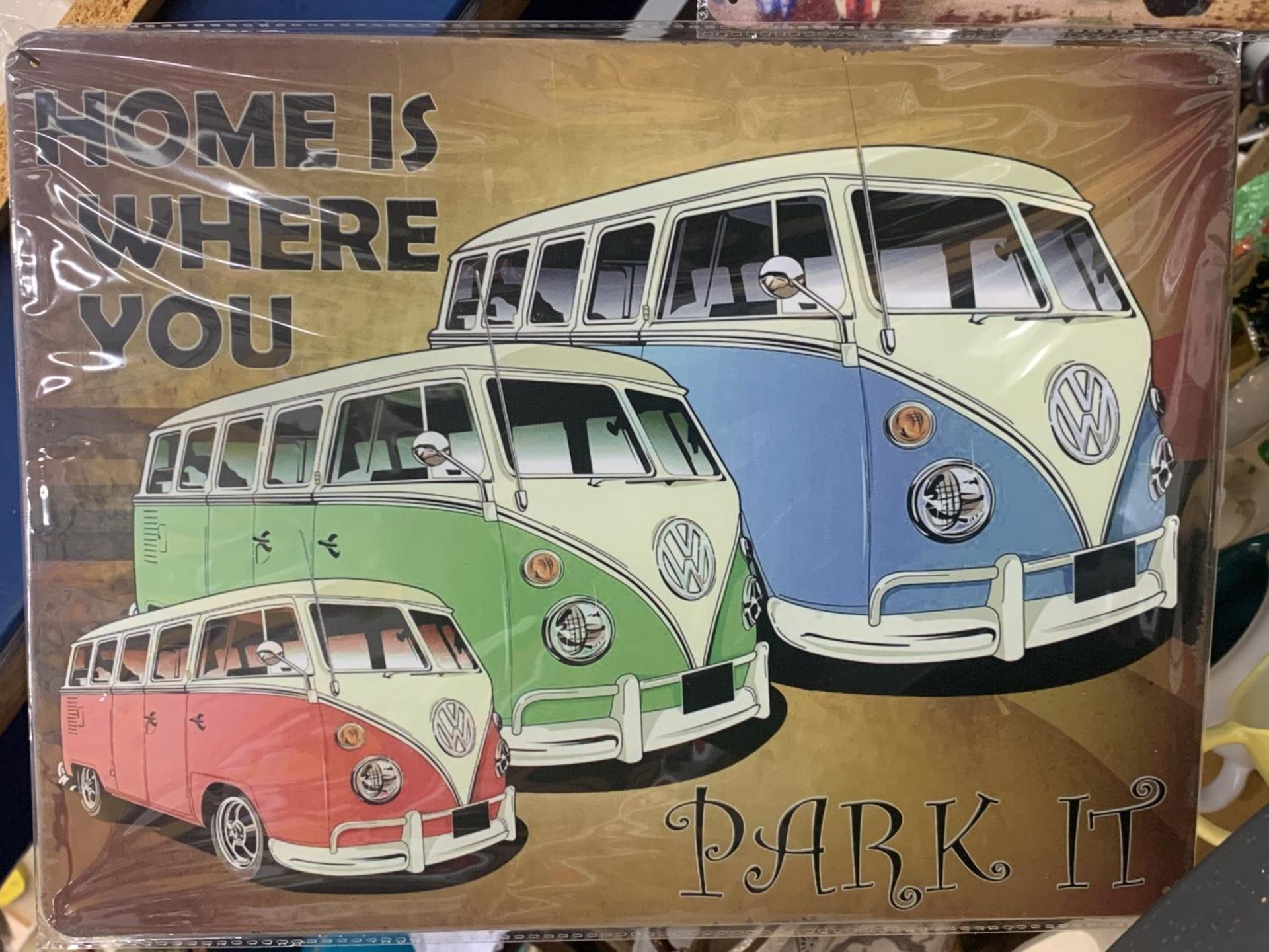 A VW TIN SIGN (HOME IS WHERE YOU PARK IT) 40CM X 30CM