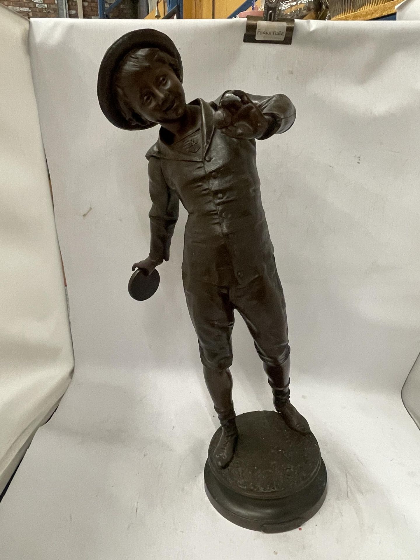 A LARGE SPELTER BOY FIGURE WITH PLAQUE TITLED 'PAN!' , HEIGHT 56CM