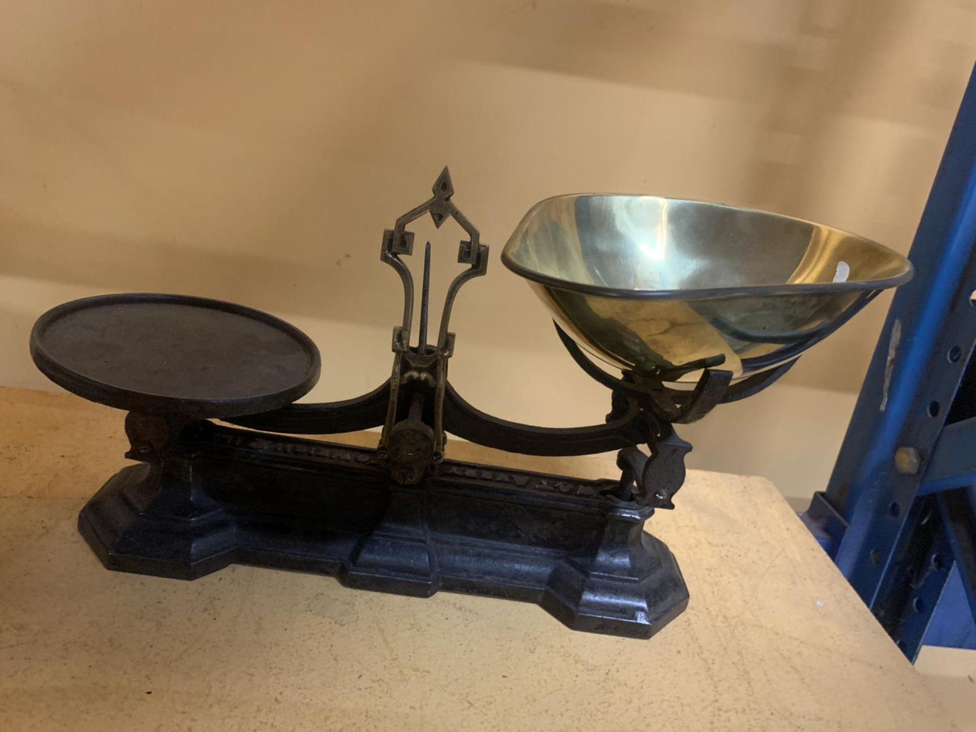 A SET OF VINTAGE CAST AND BRASS SHOP SCALES