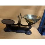 A SET OF VINTAGE CAST AND BRASS SHOP SCALES
