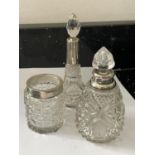 THREE CUT GLASS ITEMS TO INCLUDE A JAR WITH A HALLMARKED BIRMINGHAM COLLAR, A BOTTTLE WITH A