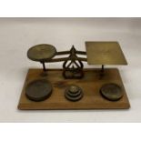 A SET OF WOOD AND BRASS LETTER SCALES WITH WEIGHTS