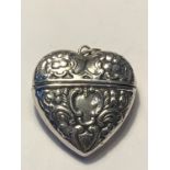 A MARKED SILVER HEART SHAPED CASE