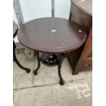 A 24.5" DIAMETER PUB TABLE ON A HEAVY CAST IRON BASE