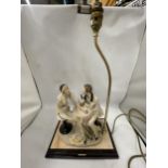 A 1987 FLORENCE CAPODIMONTE FIGURAL TABLE LAMP ON WOODEN BASE