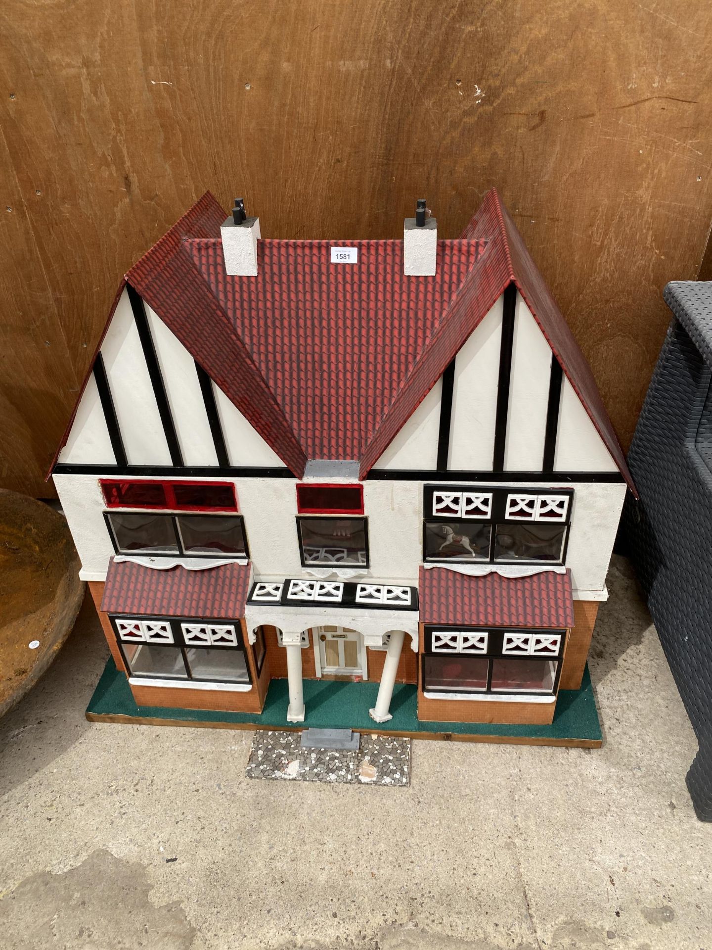 A LARGE VINTAGE WOODEN DOLLS HOUSE