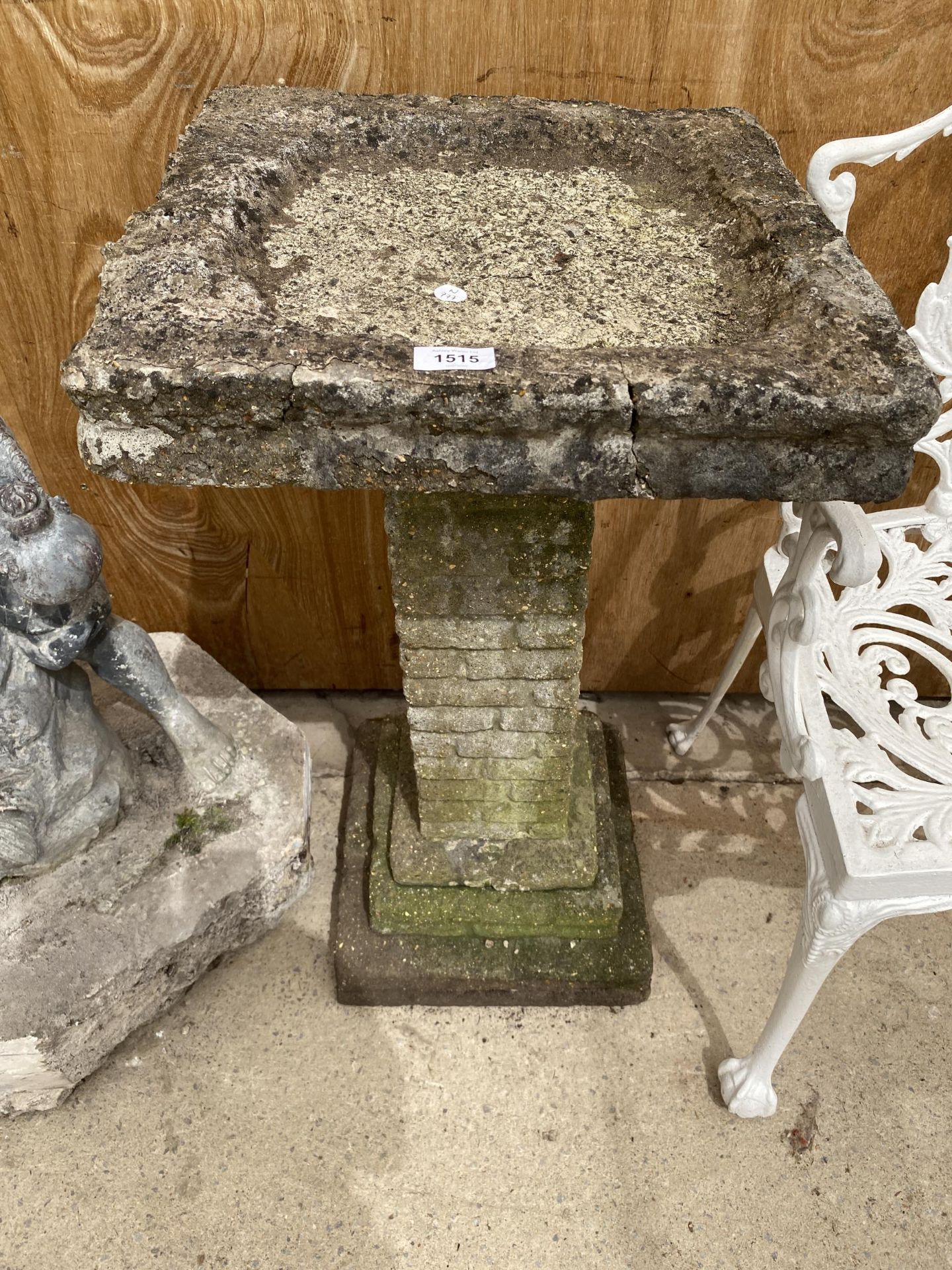 A RECONSTITUTED STONE BIRD BATH WITH PEDESTRAL BASE (H:79CM)