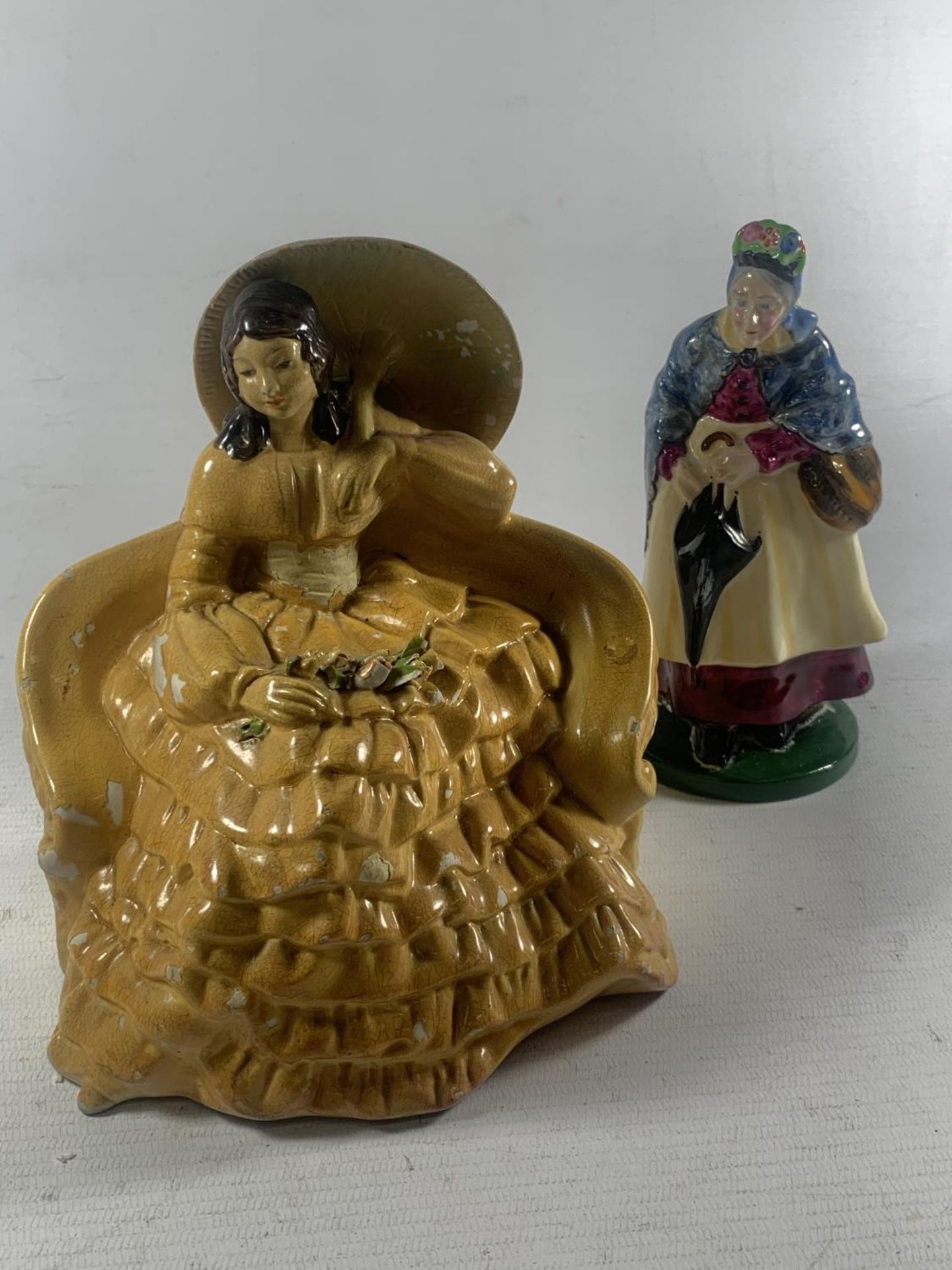 TWO FIGURES TO INCLUDE A VINTAGE WADE ROMANCE AND A CROWN STAFFORDSHIRE LADY WITH UMBRELLA