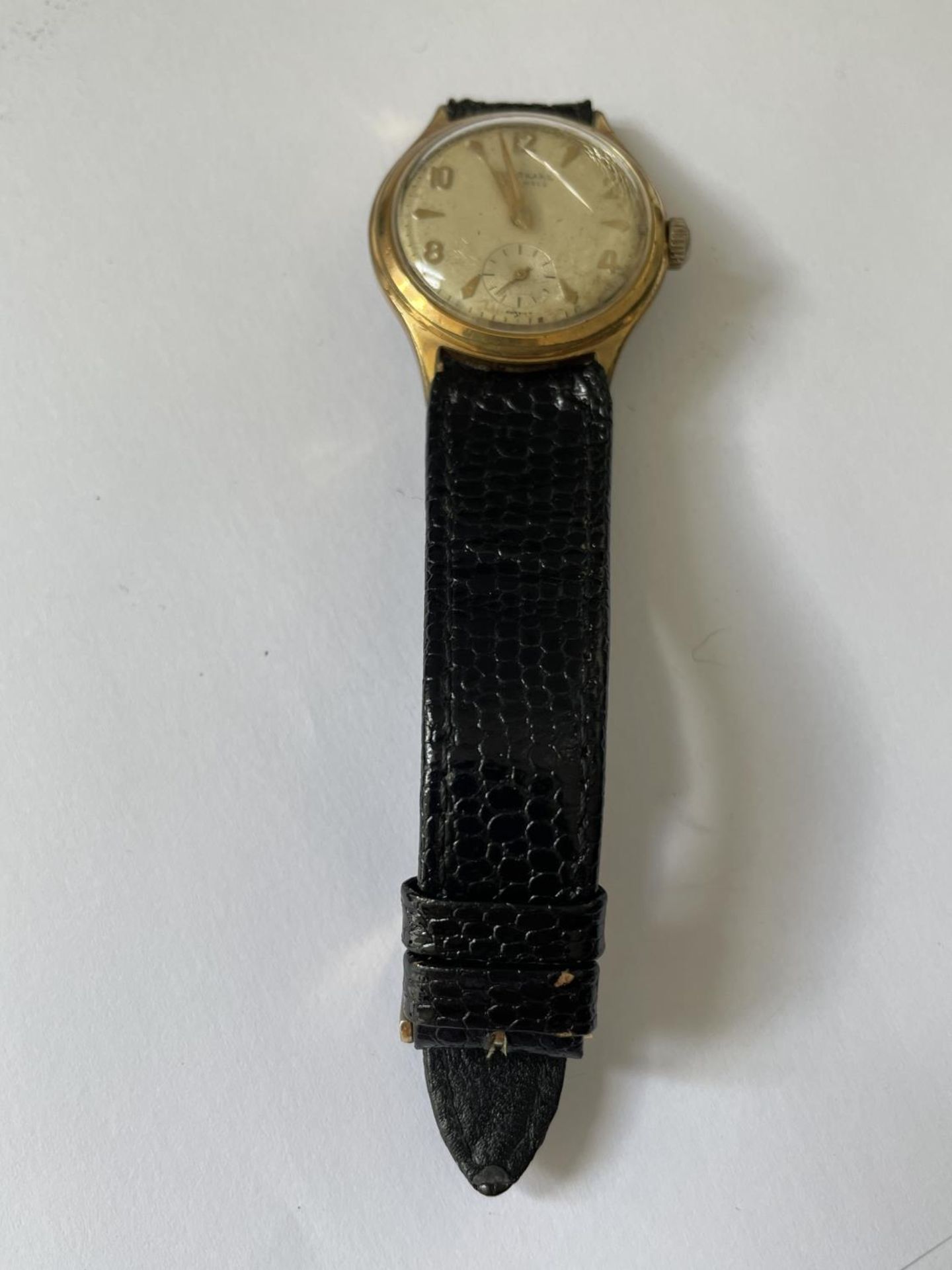 A 1960'S JUNGHANS 16 JEWEL WRIST WATCH WITH SUB DIAL AND BLACK LEATHER STRAP. SEEN WORKING BUT NO