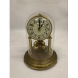 A BRASS ANNIVERSARY CLOCK WITH A DOME