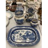 A COLLECTION OF VINTAGE BLUE AND WHITE CERAMICS TO INCLUDE A PUZZLE JUG, WILLOW PATTERN MEAT PLATE -