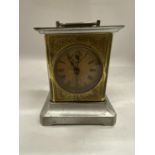 A VINTAGE BRASS AND METAL MANTLE CLOCK