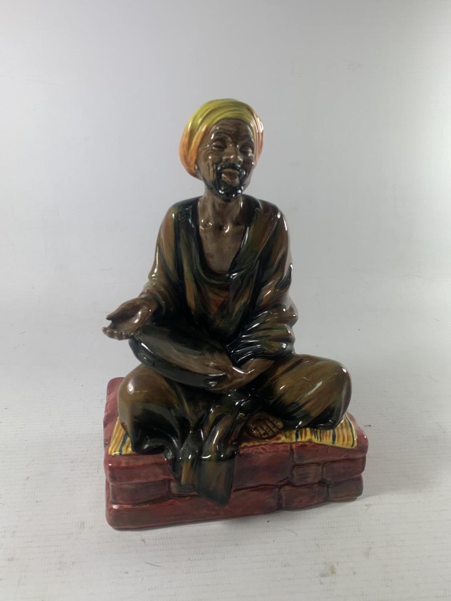 A ROYAL DOULTON FIGURINE MENDICANT HN 1365