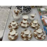 A ROYAL ALBERT COFFEE SET TO INCLUDE A COFFEE POT, SUGAR BOWL, CREAM JUG, CUPS, SAUCERS AND SIDE