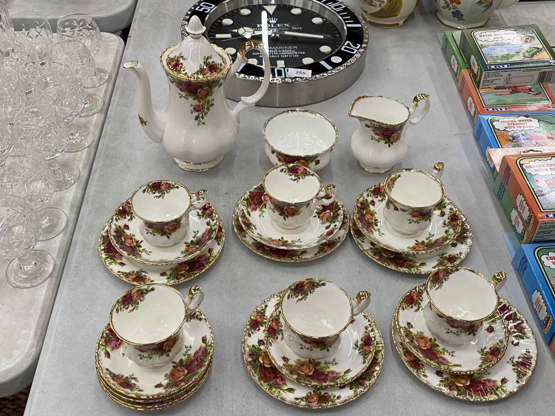A ROYAL ALBERT COFFEE SET TO INCLUDE A COFFEE POT, SUGAR BOWL, CREAM JUG, CUPS, SAUCERS AND SIDE