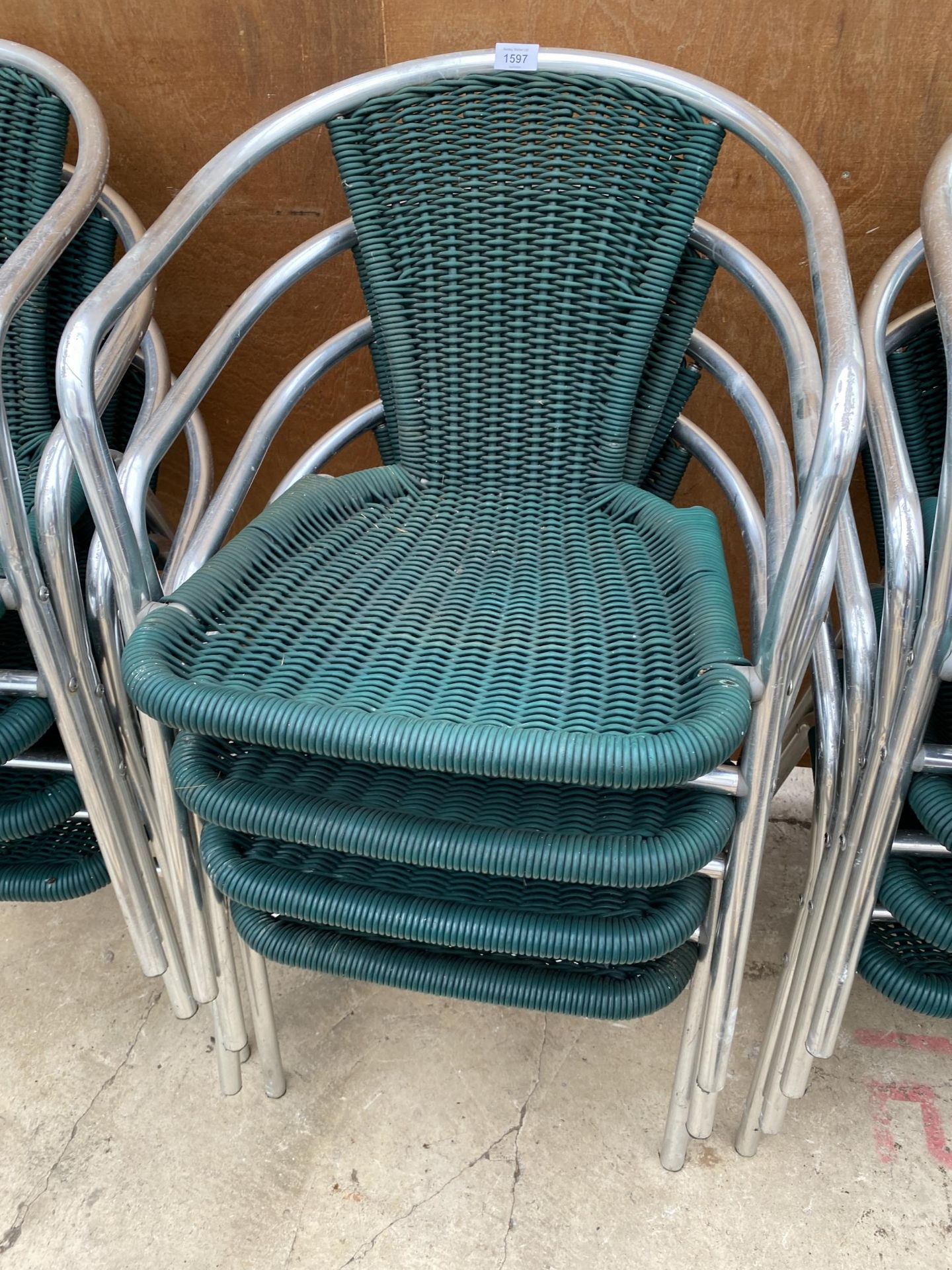 FOUR CHROME AND RATTAN BISTRO STACKING CHAIRS