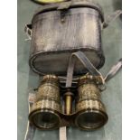 A PAIR OF LEATHER CASED BRASS BINOCULARS