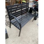 A WOODEN SLATTED GARDEN BENCH WITH METAL ENDS