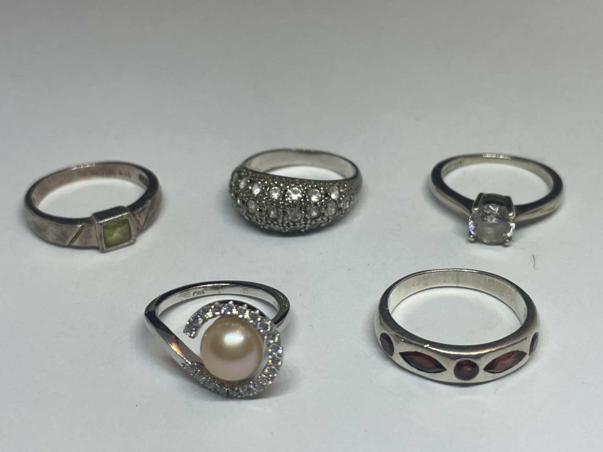 FIVE VARIOUS SILVER RINGS