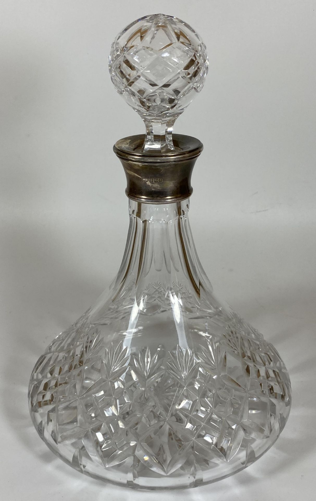 A CUT GLASS SHIPS DECANTER WITH MAPPIN & WEBB HALLMARKED SILVER COLLAR, HALLMARKS FOR BIRMINGHAM