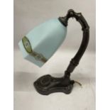 AN ART NOUVEAU METAL TABLE LAMP WITH FROSTED GLASS SHADE