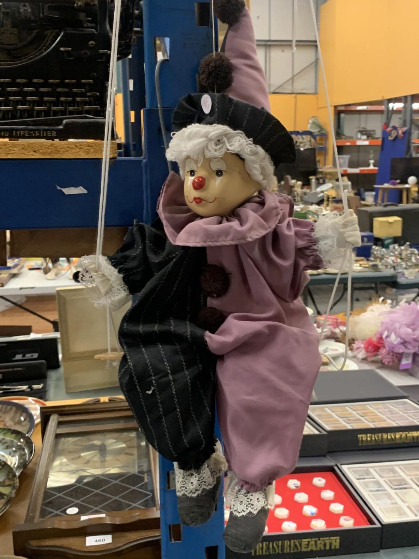 A CLOWN ON A SWING PUPPET