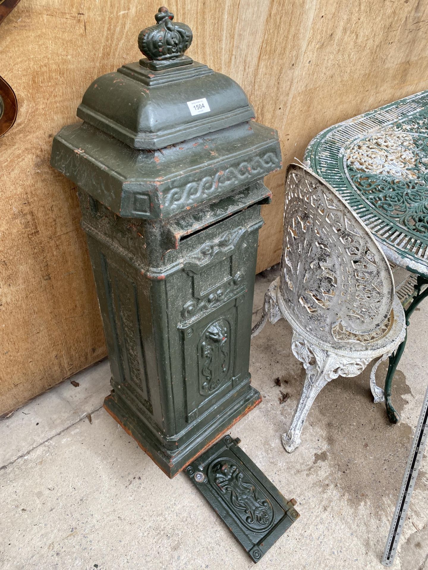 A VINTAGE CAST IRON GREEN GARDEN POST BOX