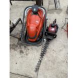 AN ELECTRIC EASIGLIDE FLYMO LAWN MOWER AND A MOUNTFIELD PETROL HEDGE TRIMMER
