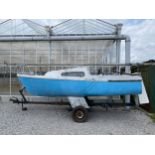 A FOXCUB 18 TWIN KEEL SAILBOAT WITH LAUNCHING TRAILER (NOT ROAD WORTHY) DRY STORED FOR THE LAST 8