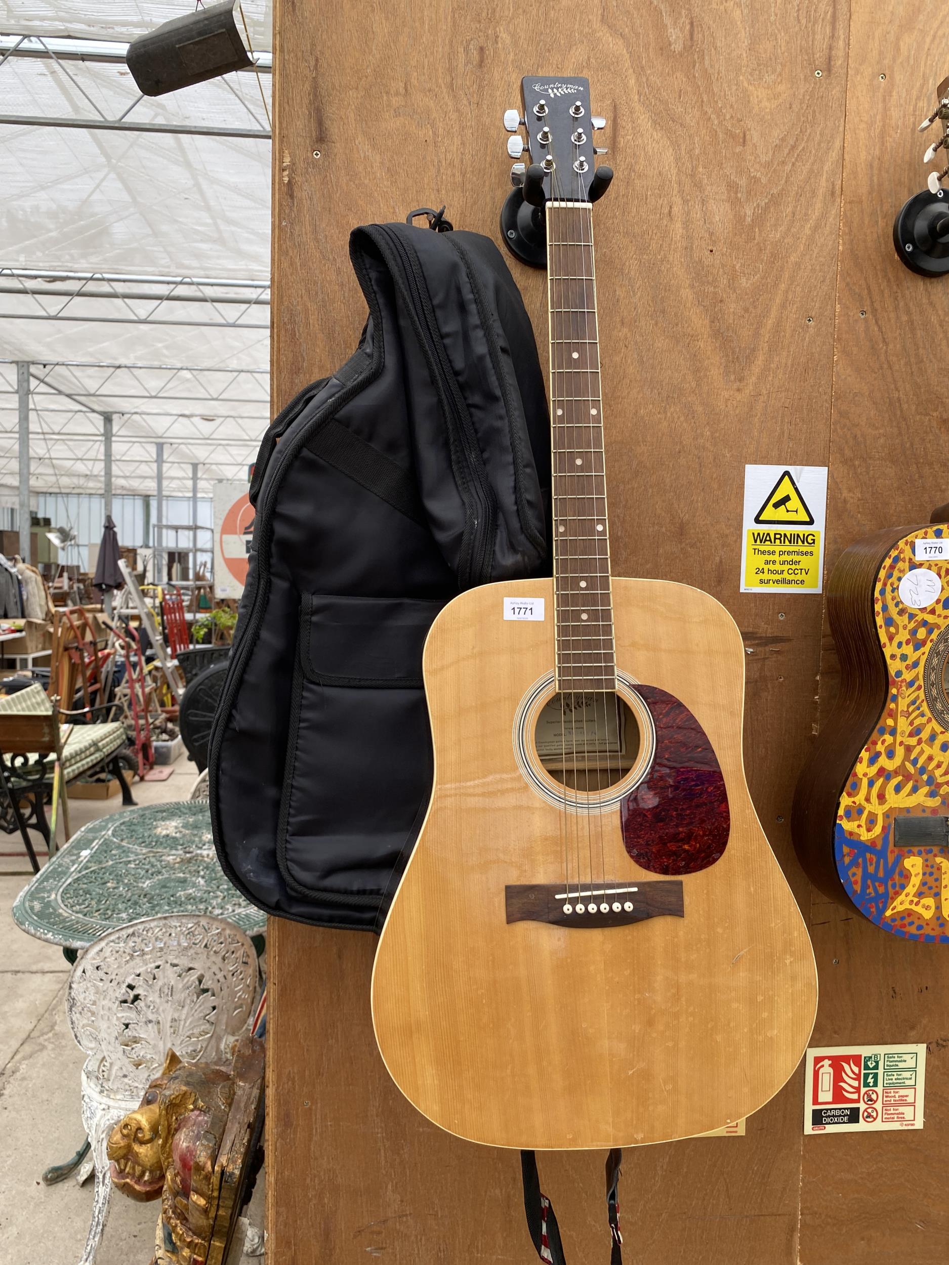 A COUNTRYMAN ACOUSTIC GUITAR WITH CARRY CASE