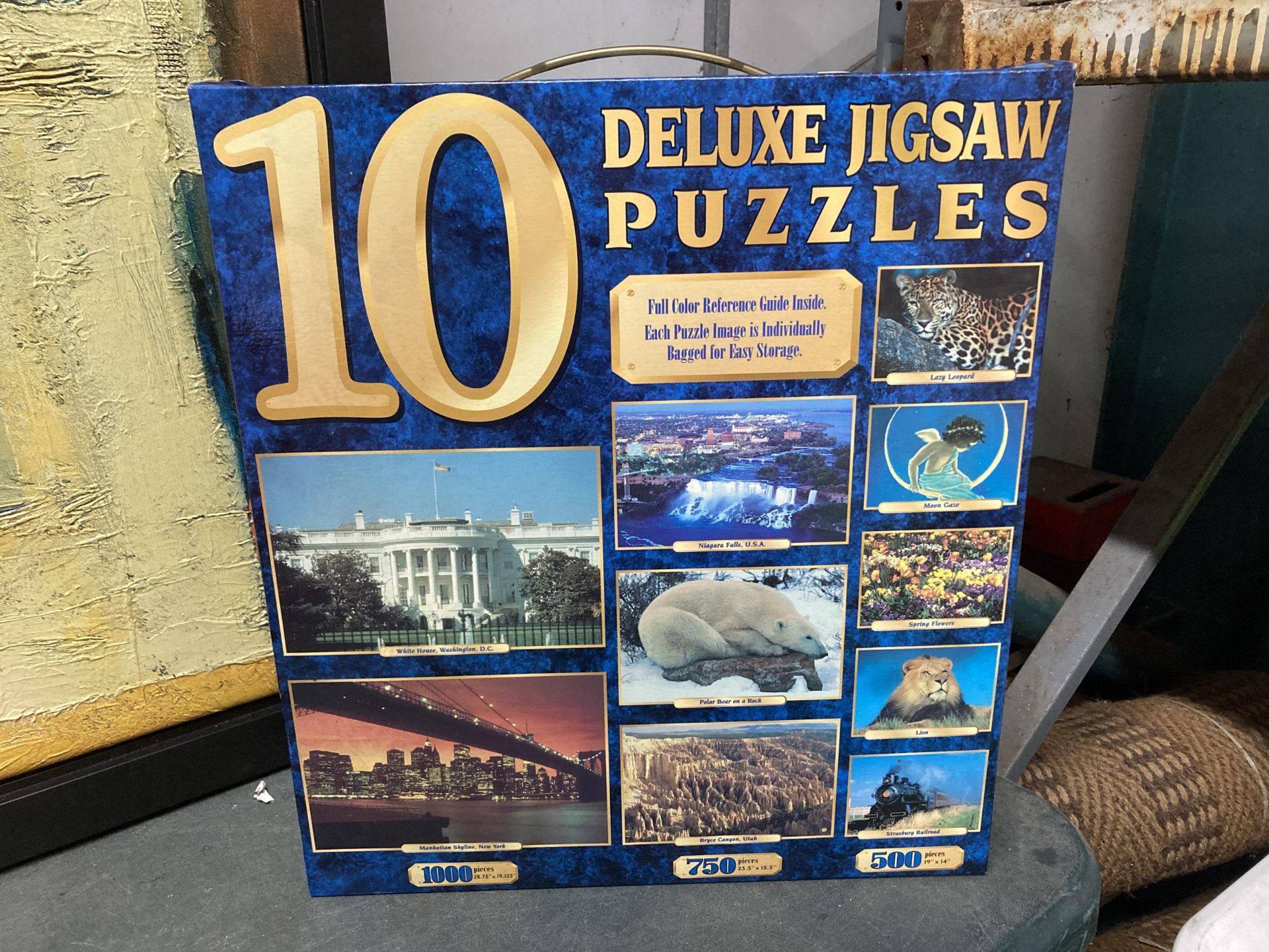 A BOXED 10 DELUXE JIGSAW PUZZLES - AS NEW