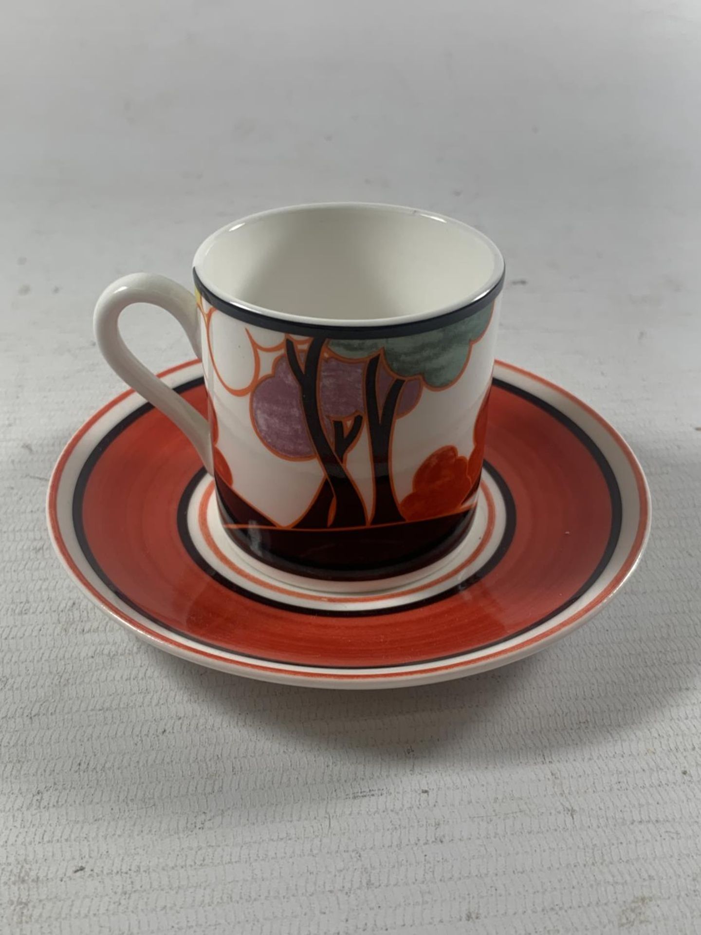 A LIMITED EDITION WEDGEWOOD CUP AND SAUCER AUTUMN