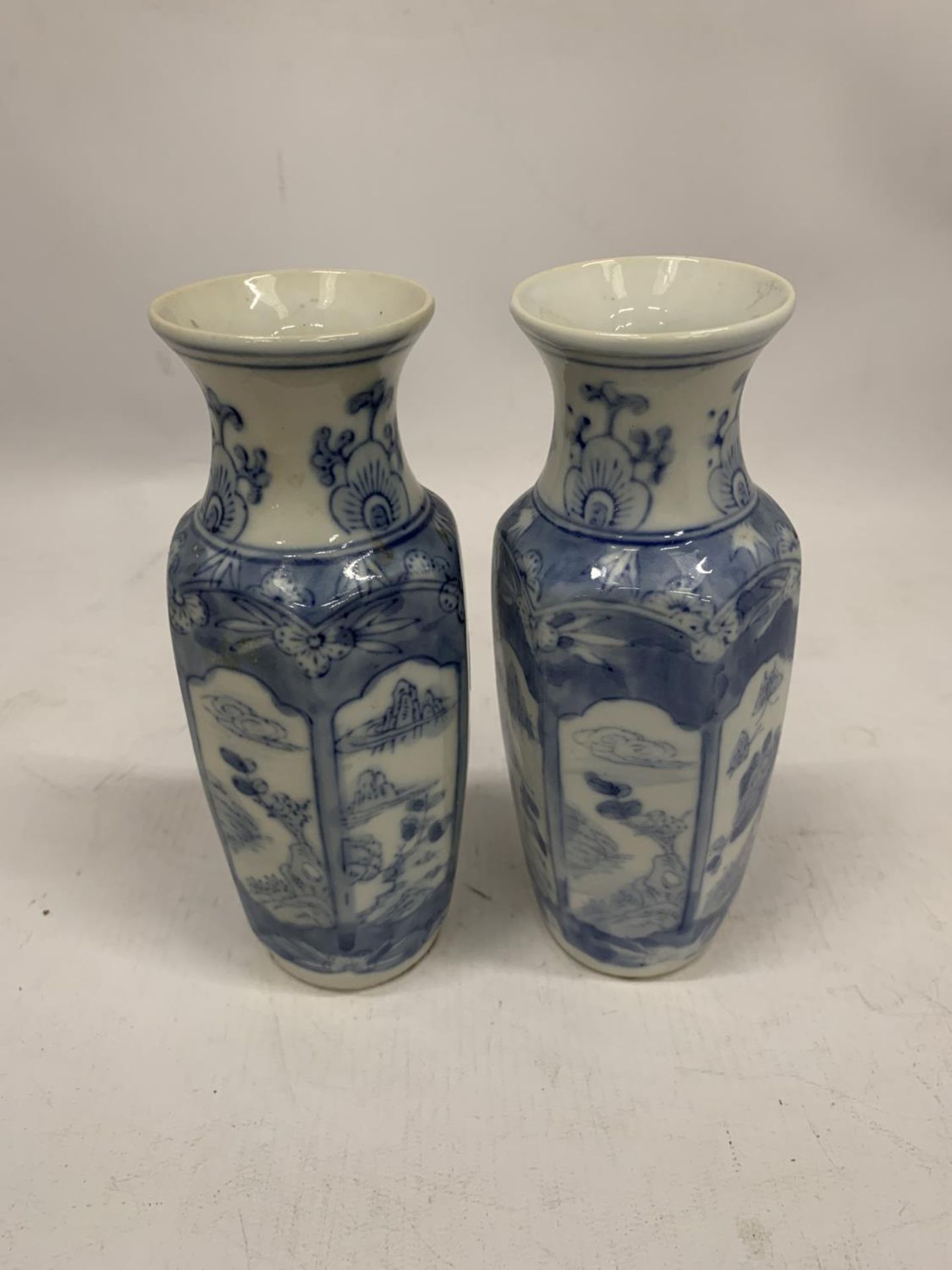 A PAIR OF ORIENTAL BLUE AND WHITE VASES HEIGHT 17.5CM