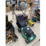 A PETROL LAWN MOWER WITH GRASS BOX BELIEVED IN WORKING ORDER BUT NO WARRANTY