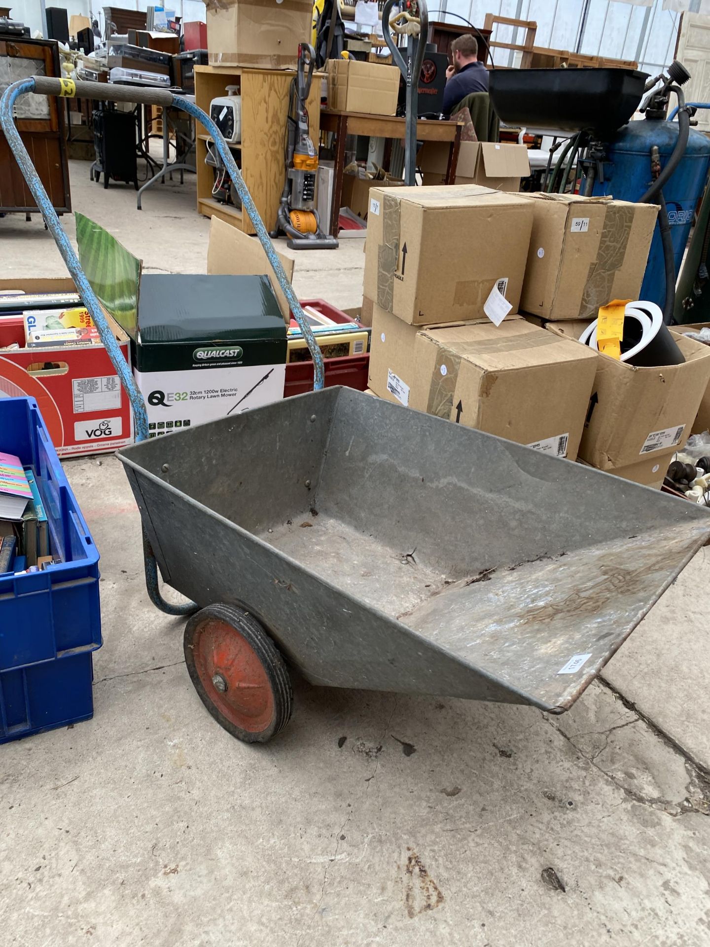 A GALVANISED LOW WHEEL BARROW/TROLLEY