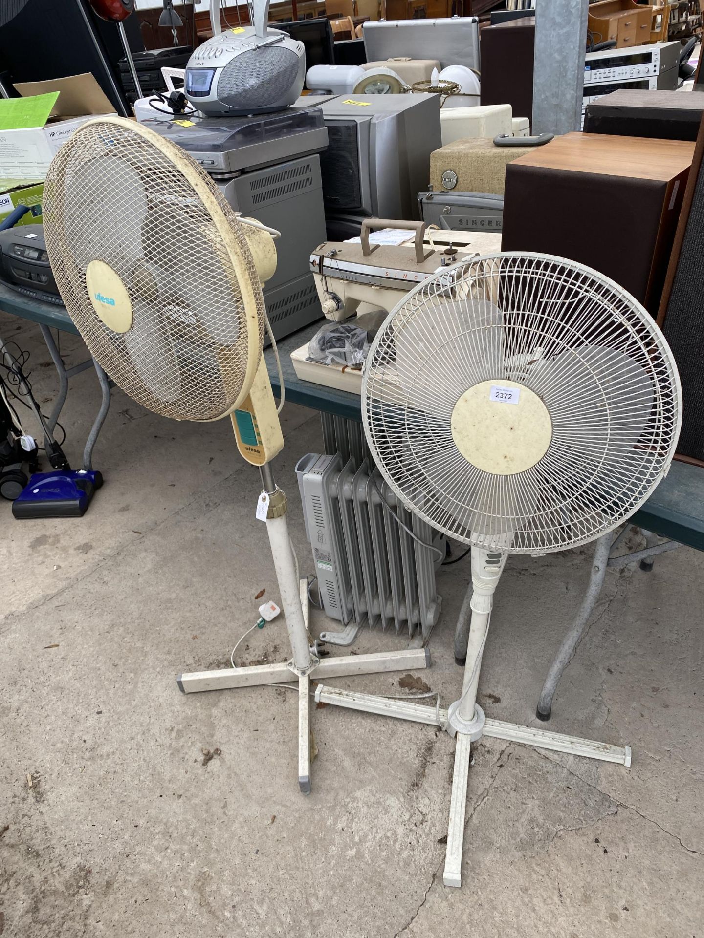 TWO ELECTRIC FLOOR FANS - WORKING AT TIME OF CATALOGUING, NO WARRANTY GIVEN