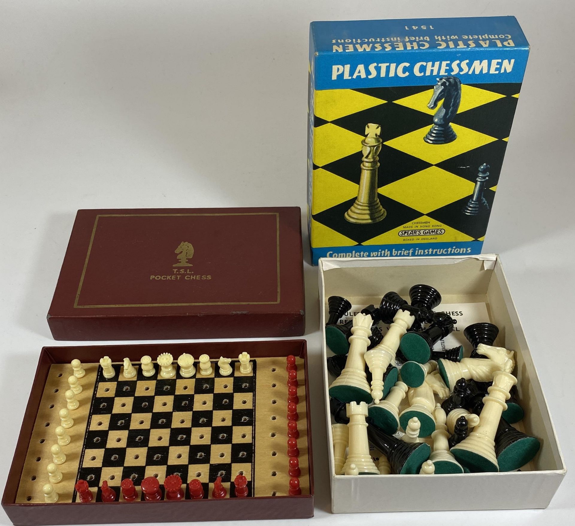 TWO CHESS SETS - BOXED PLASTIC CHESSMEN AND T.S.L TRAVELLING SET, BOTH COMPLETE